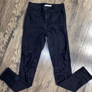 High waisted black distressed Levi’s